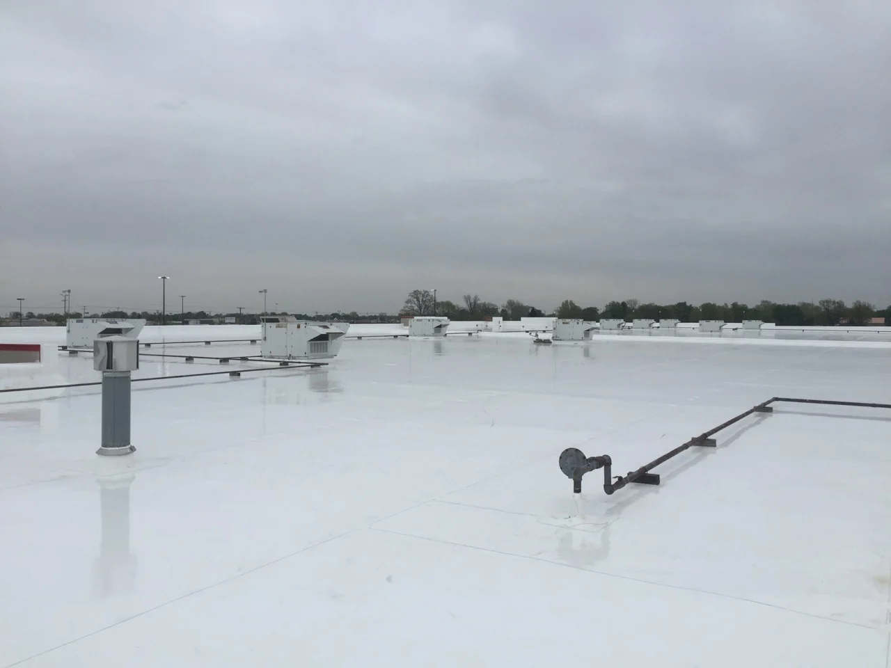 Completed white commercial roofing system